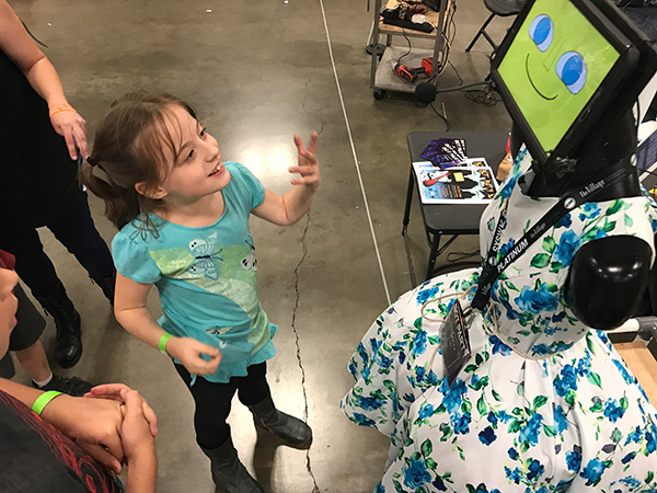 child talks with robot